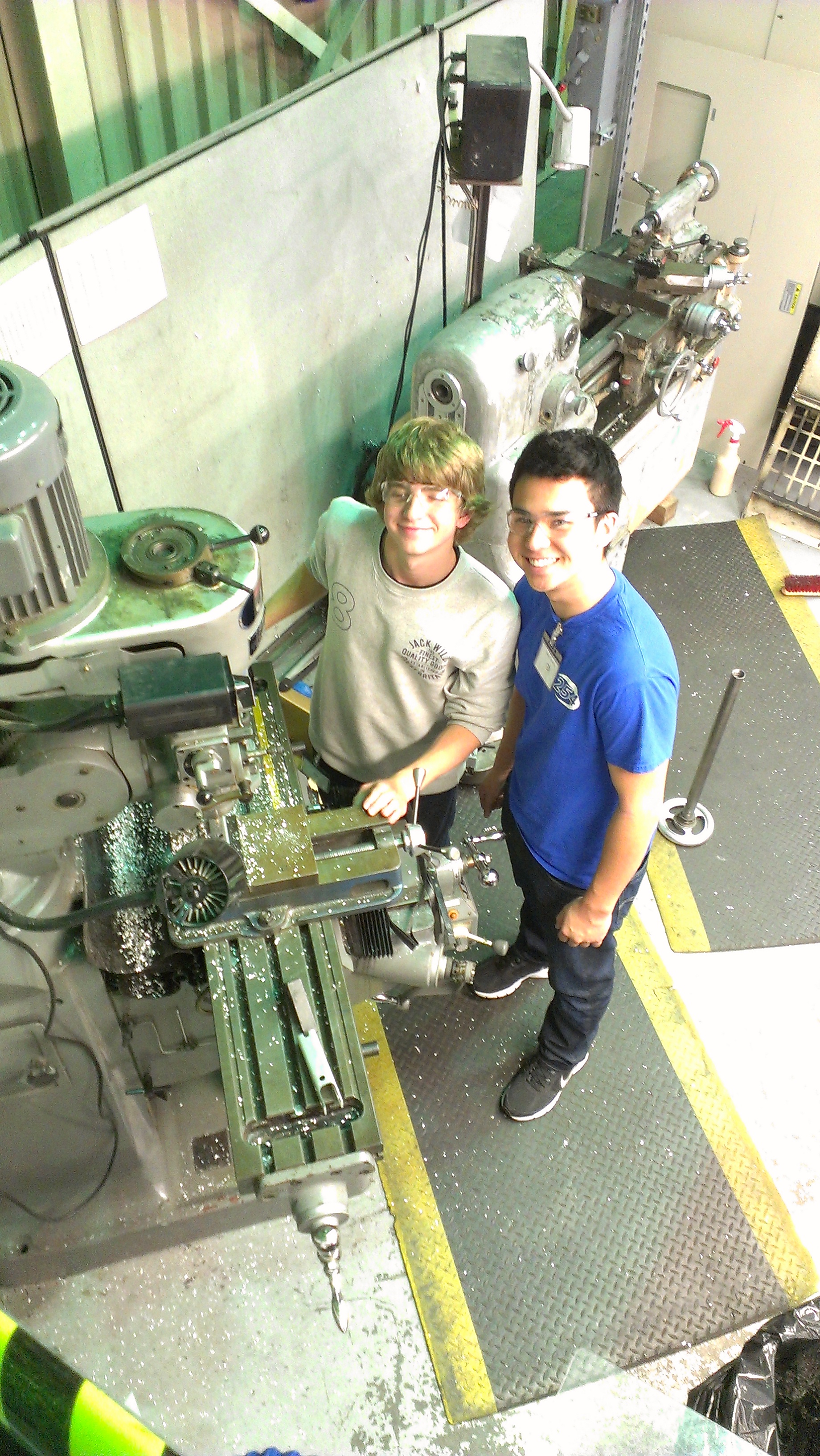 Joey and Alex mill parts for the updated catcher. The parts they are milling are to be used on the new catcher to allow for more stability.