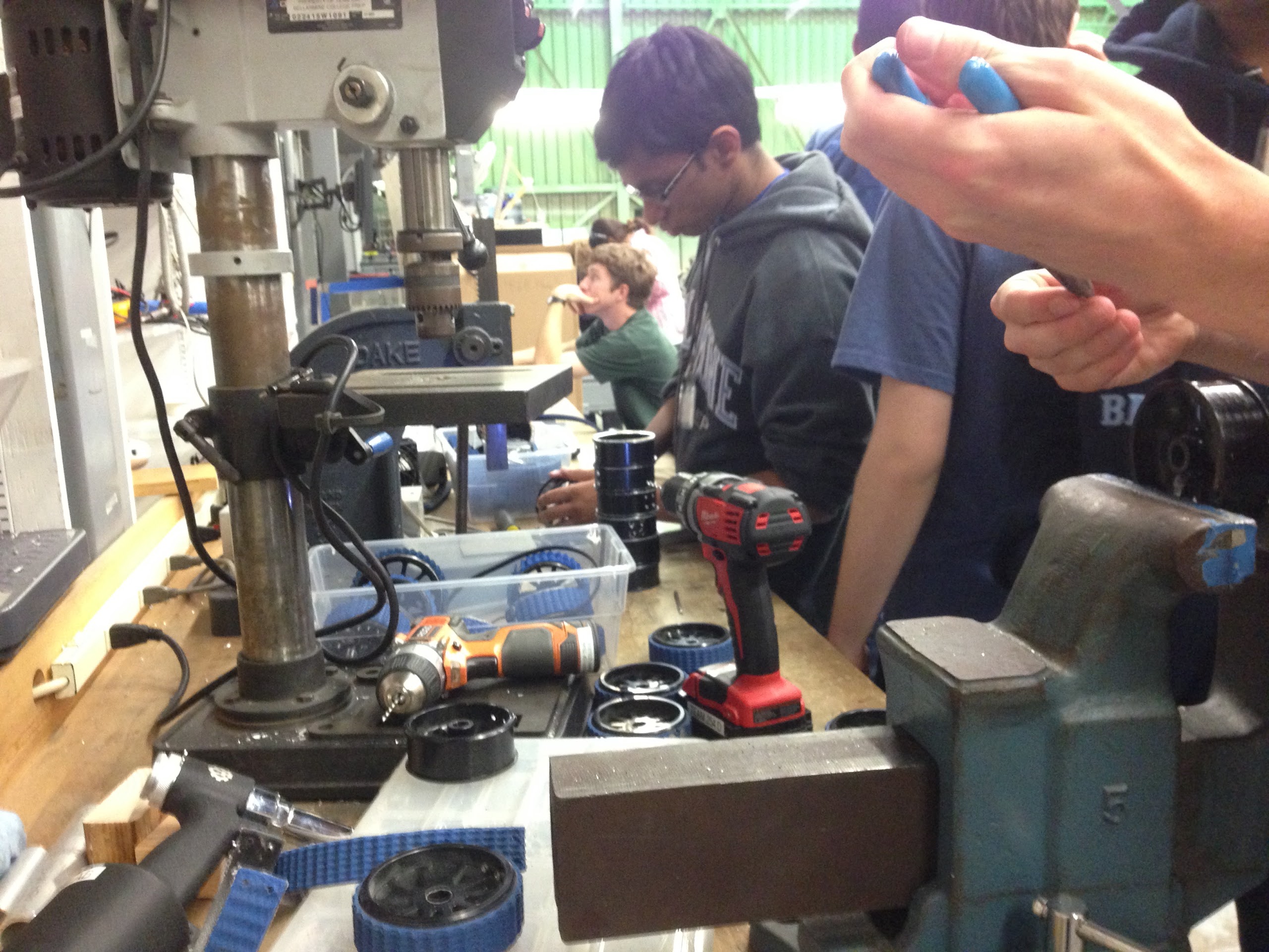 Builders attaching tread to the wheel hubs