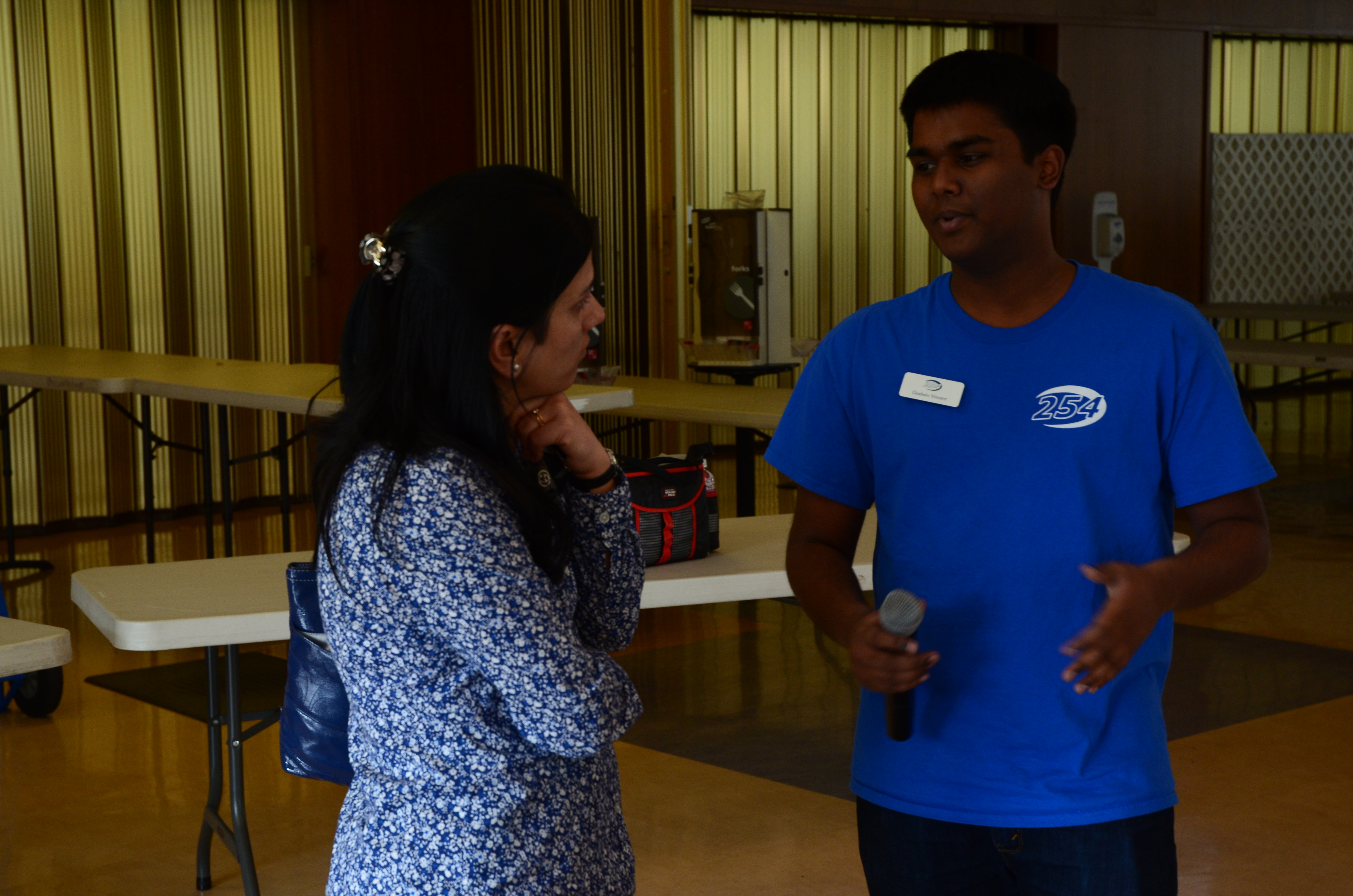 Godwin talking to parent about robotics