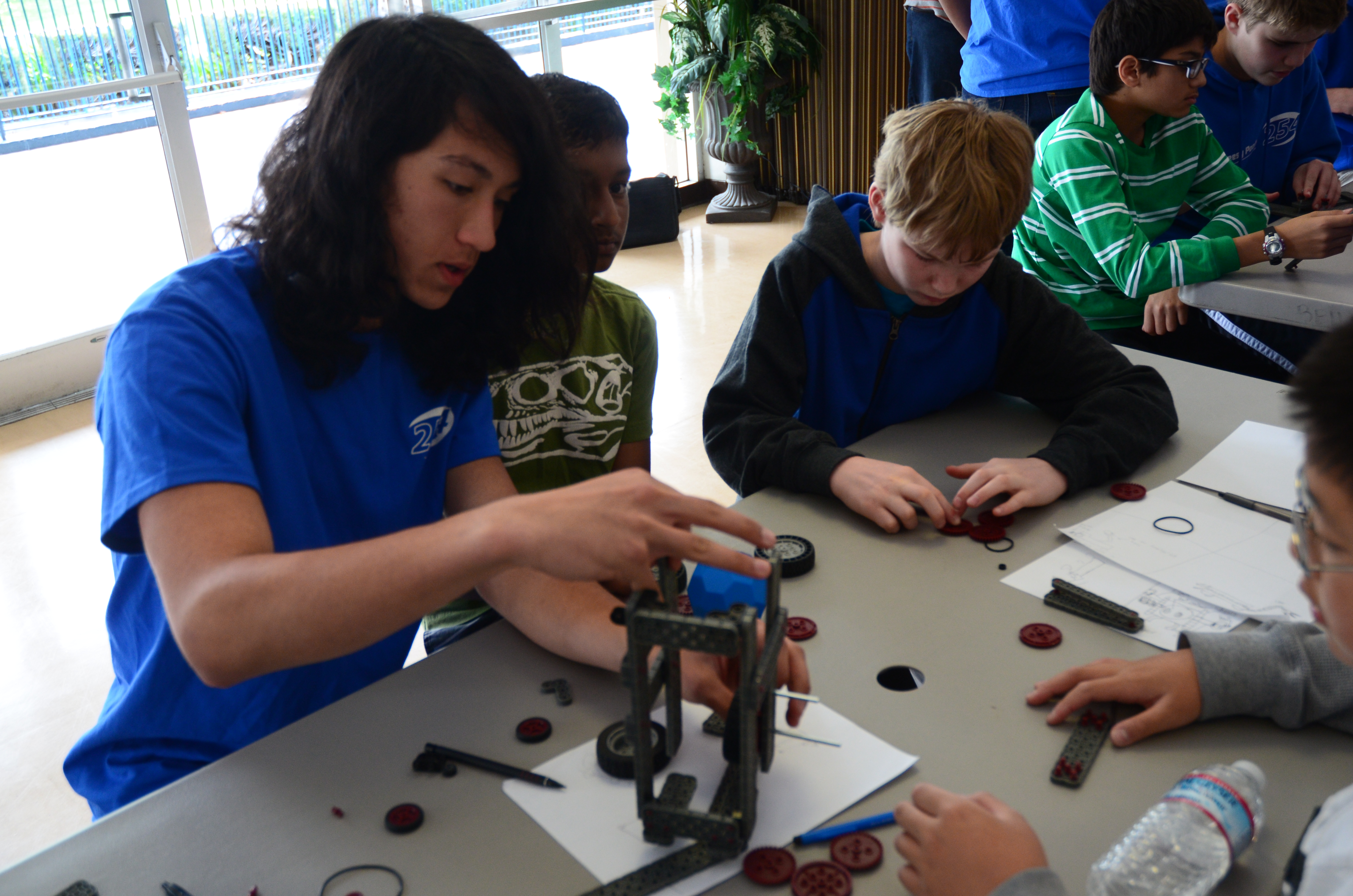 Noah working with middle schoolers to build intake