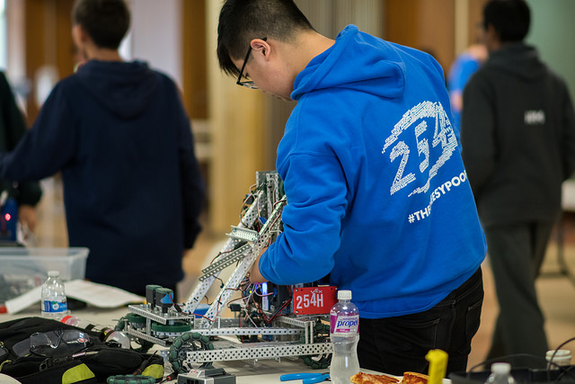 Brandon of Team 254H makes adjustment on the robot after a match.